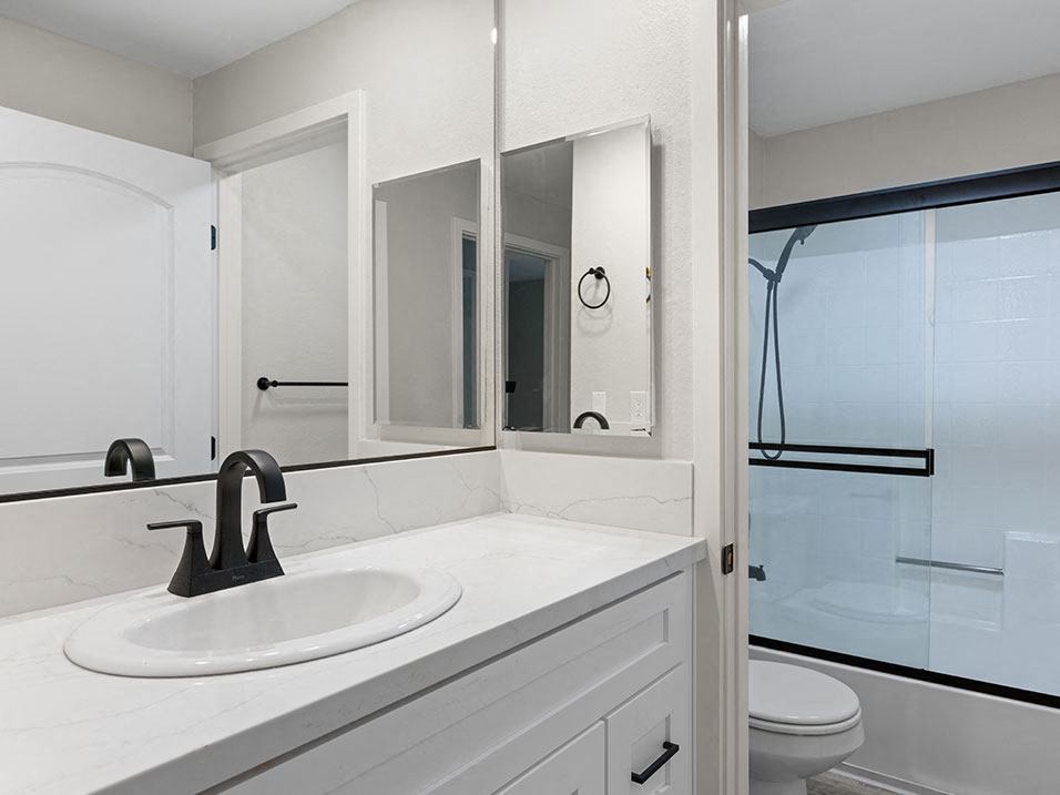 Modern styled bathroom with shower and tub.