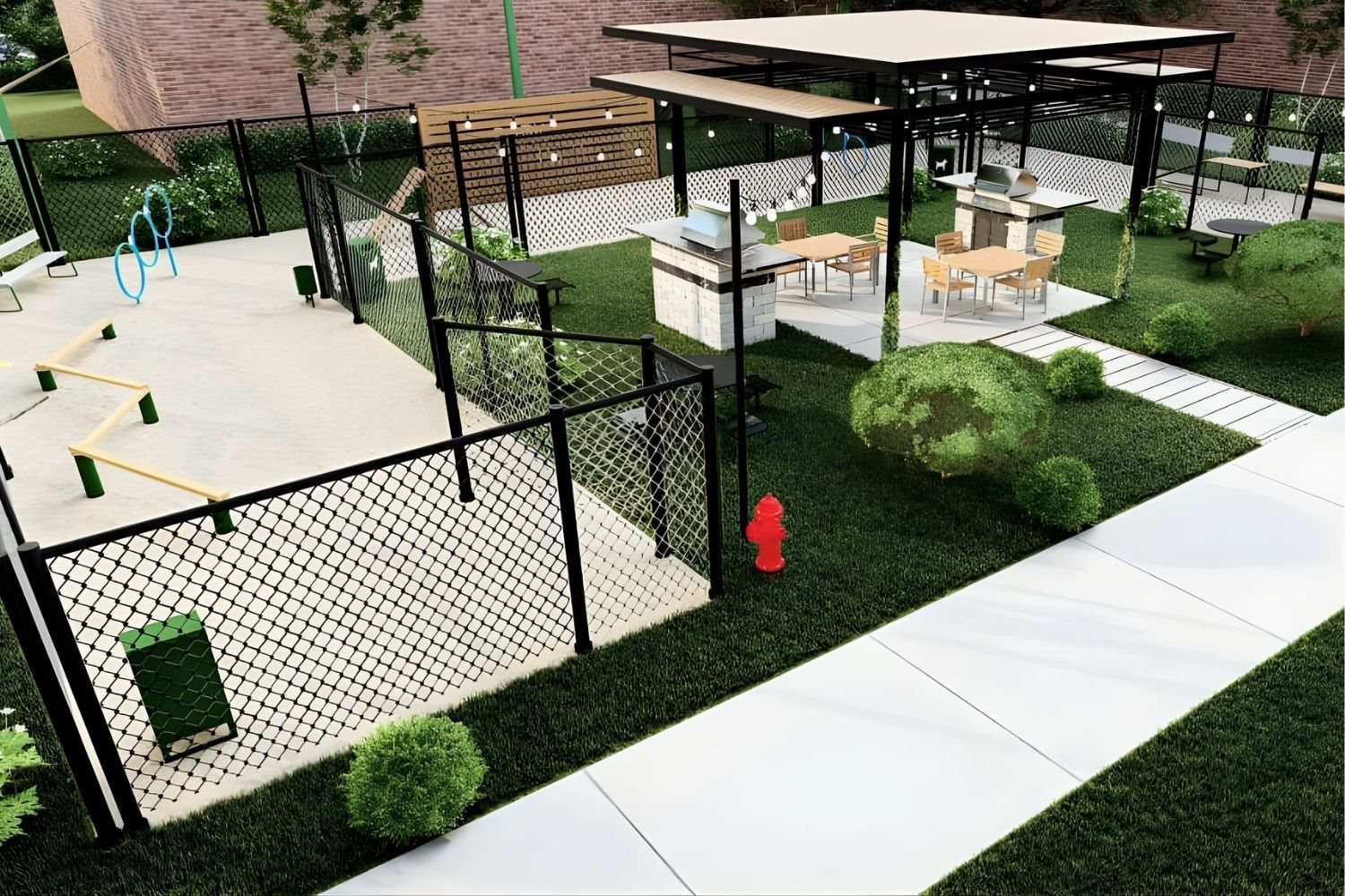 Fenced pet play area beside covered outdoor pavilion with grills and seating