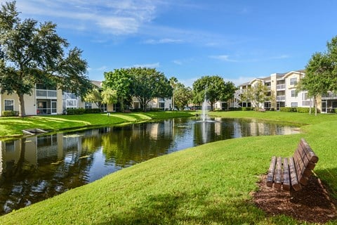 Hunters Glen Apartments Sarasota Bench with Buildings and Lake