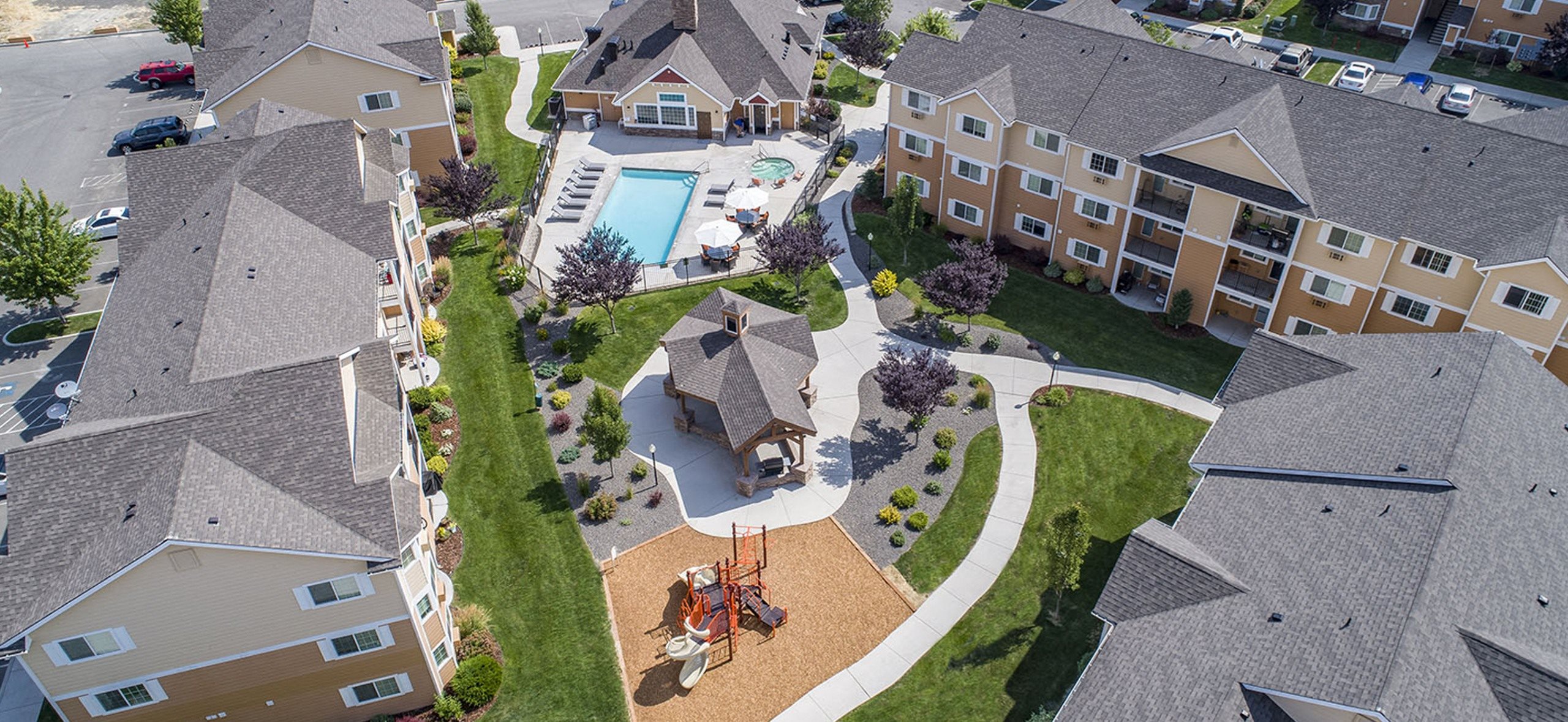 an aerial view of a neighborhood with houses and a swimming pool  at Quail Springs, Washington