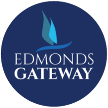 a blue logo with the words edmonds gateway with a blue flame