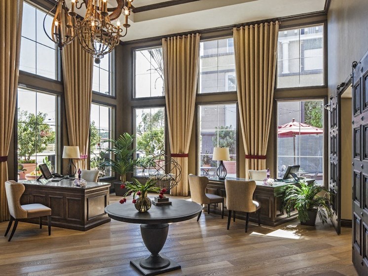 Leasing office and lobby space with beautiful large windows and tasteful wooden decor