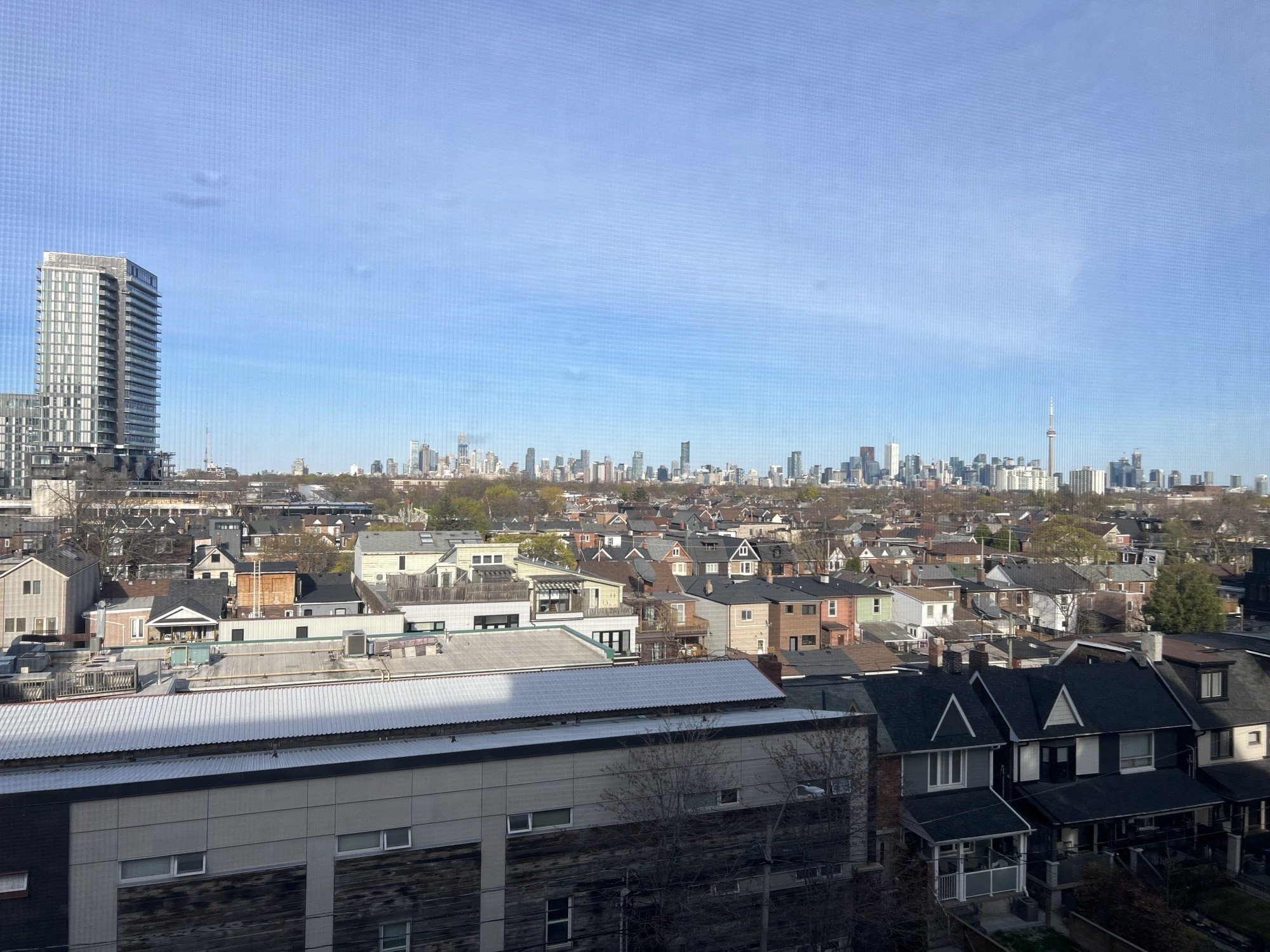 the view of the city from the roof of a building