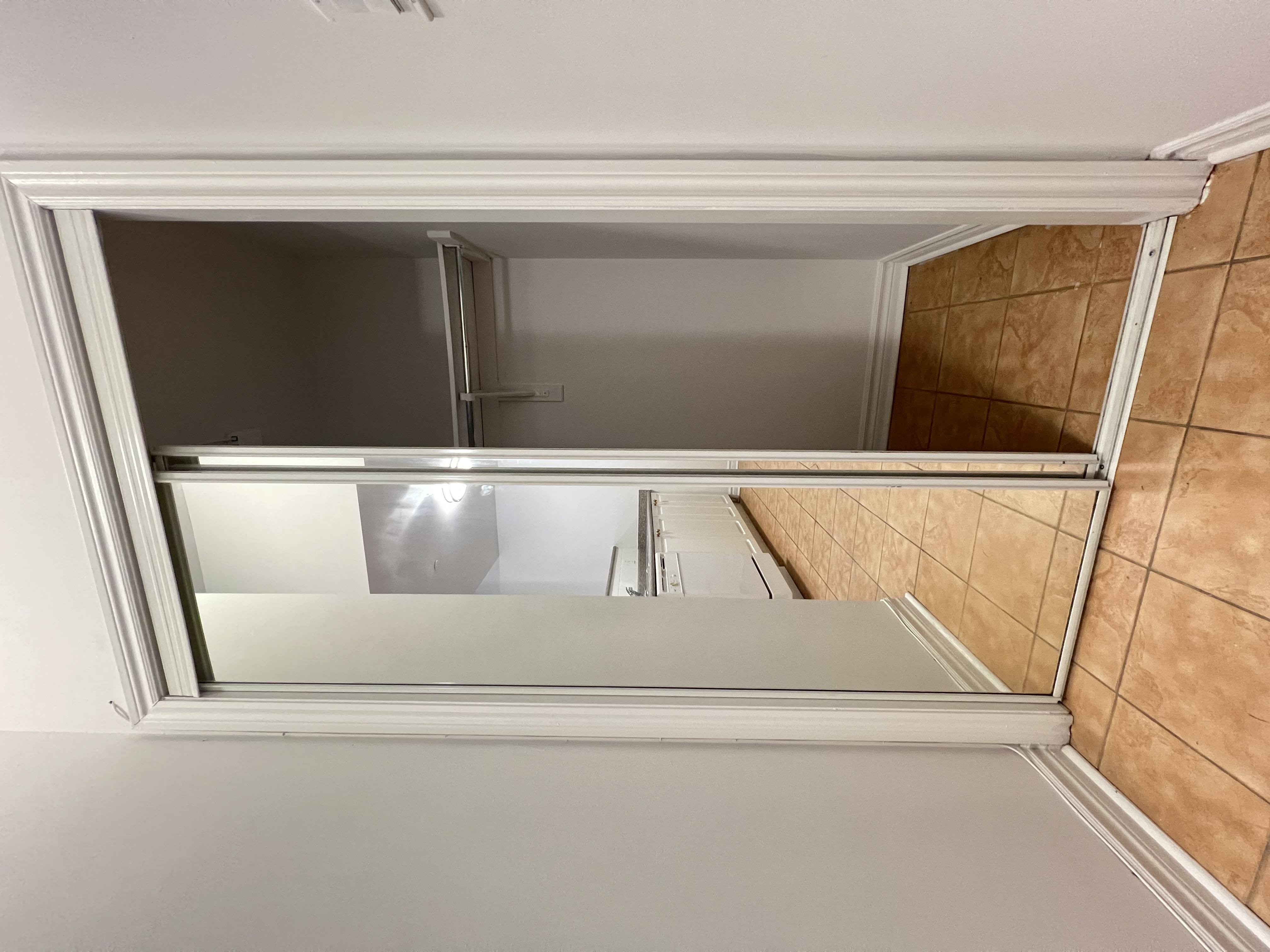 the view from the bottom of a window into a bathroom