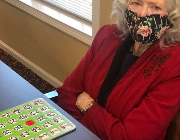 Senior With Bingo Board Game at Savannah Court of Lake Oconee, Georgia