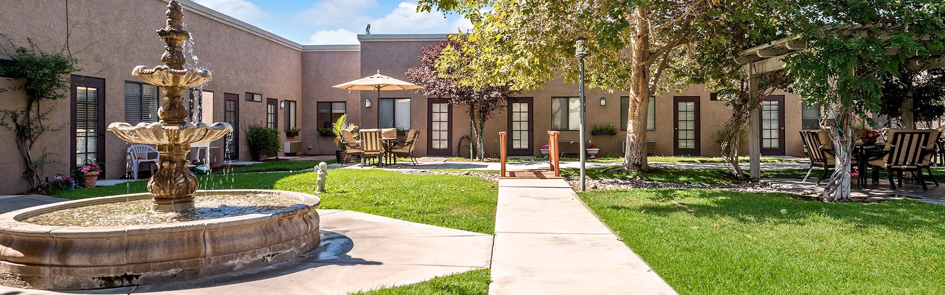 Beautifully landscaped grounds with mountain views at Sierra Vista Independent & Assisted Living, Victorville