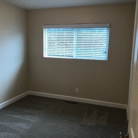 an empty room with a window in it