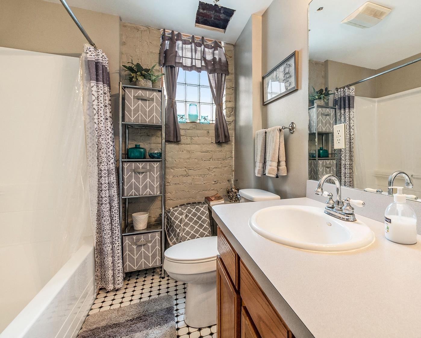 a bathroom with a toilet sink and shower