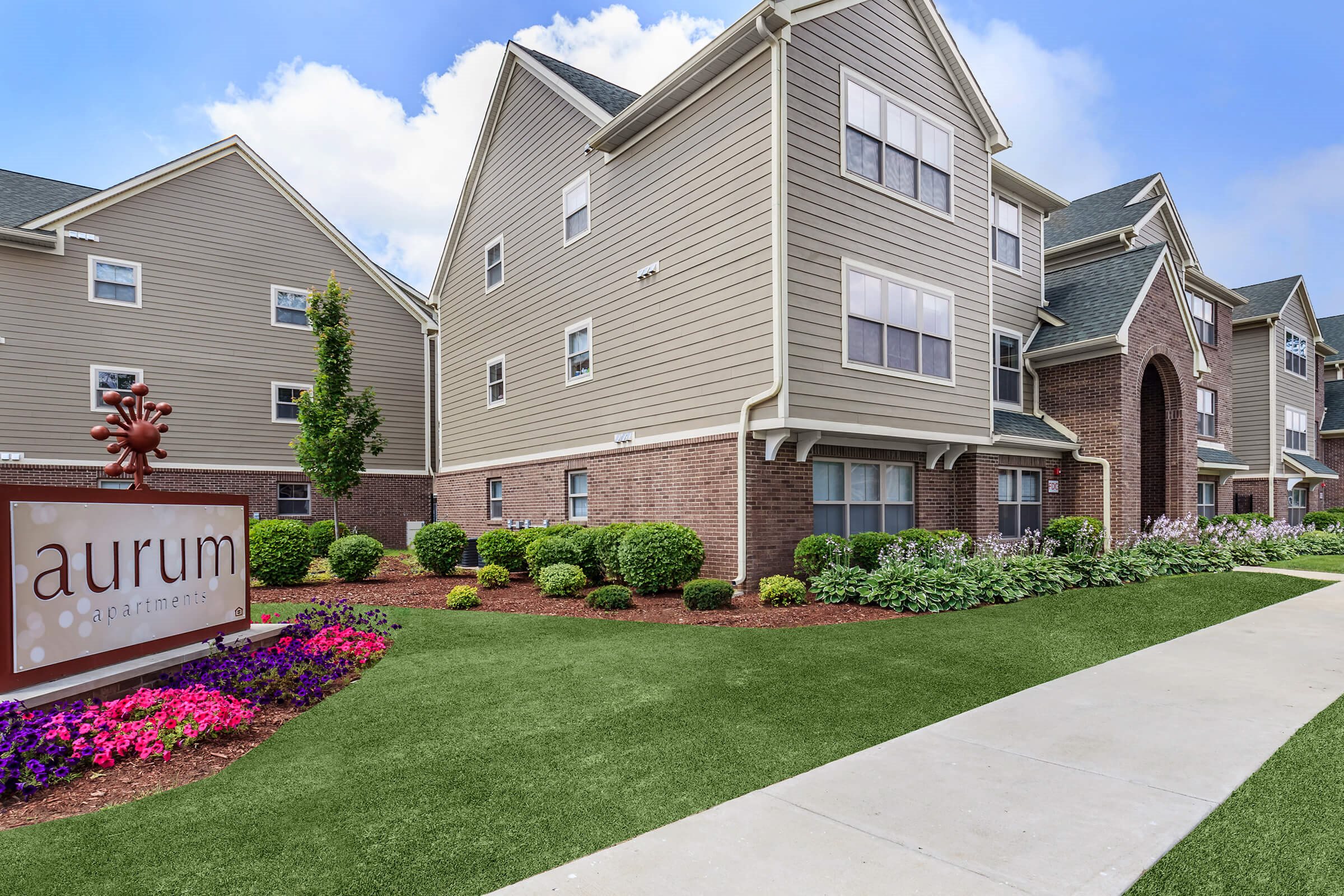 A residential area with a sign that says "aurum".