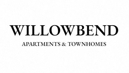 a large white building with a sign that reads willowbend apartments and townhomes
