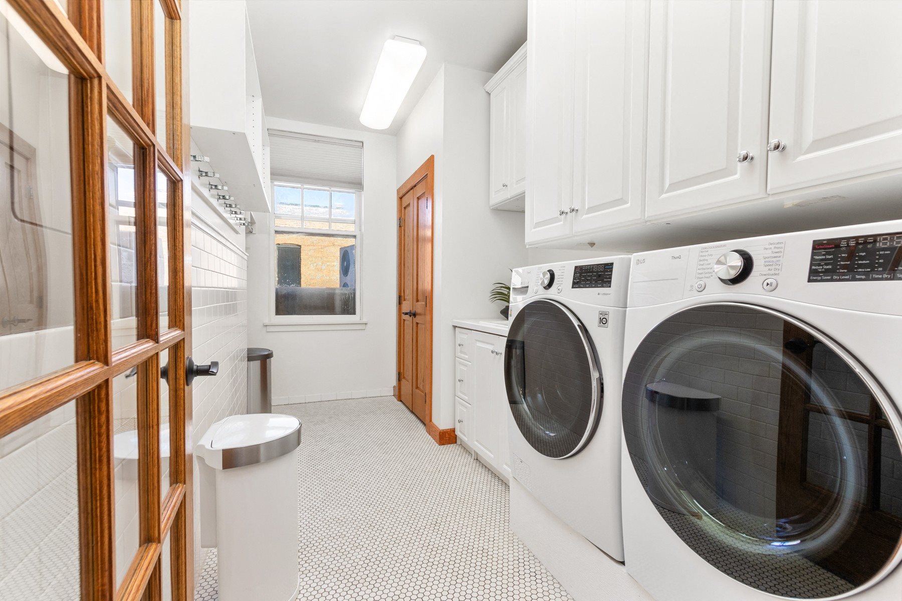A laundry room with a washer and dryer.