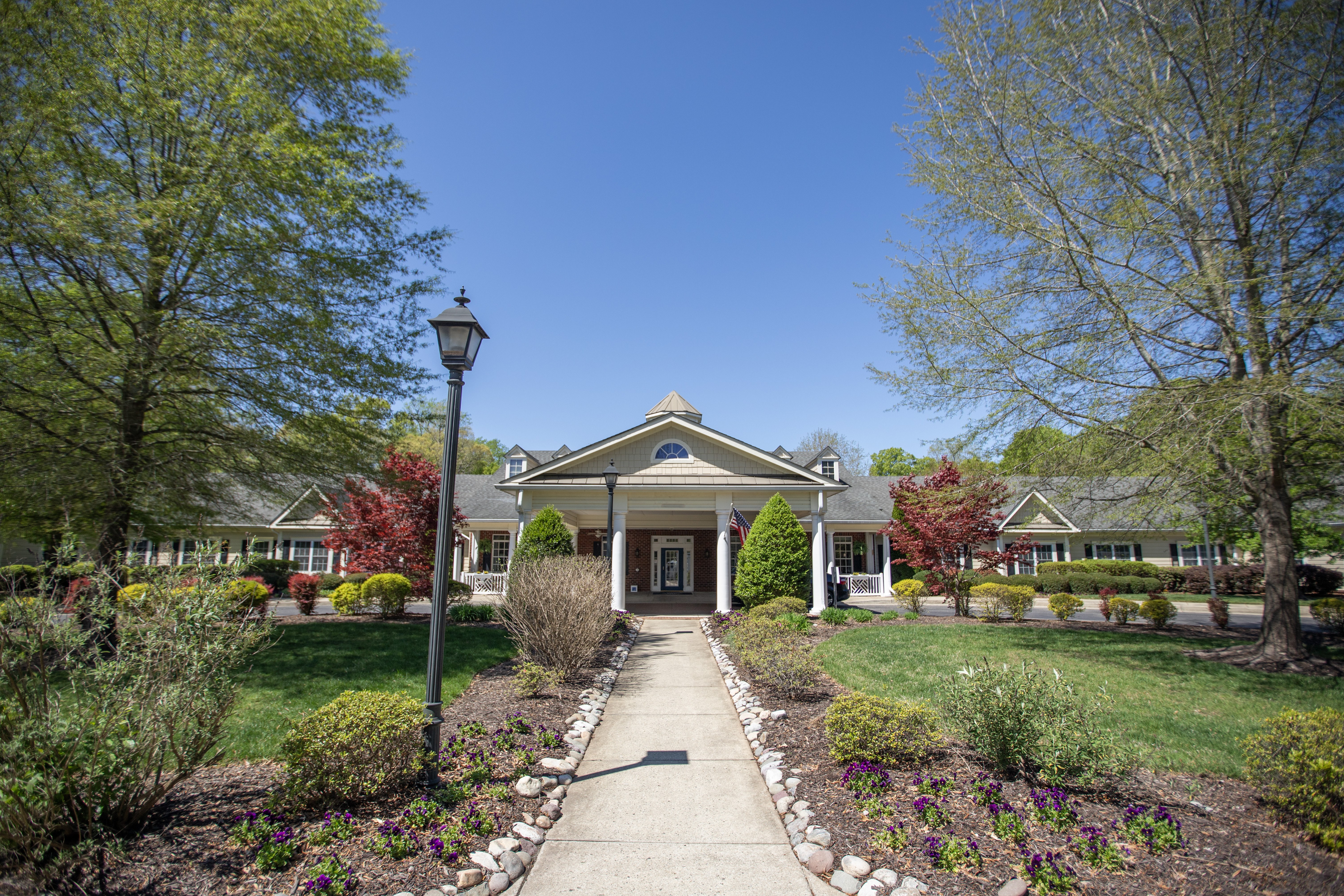 A house with a front yard and a lamp post.at Spring Arbor of Williamsburg, Williamsburg, Virginia