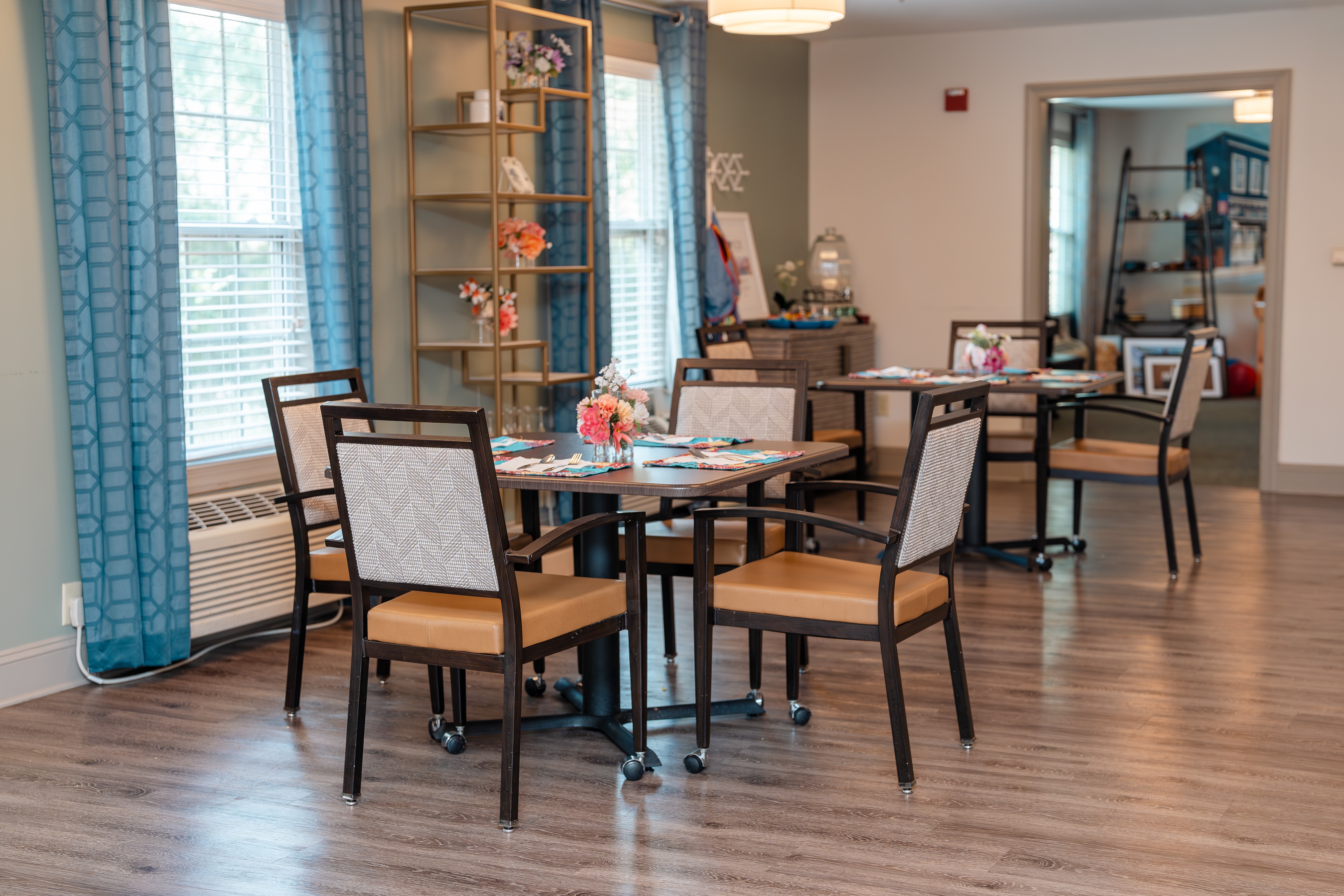A dining room with a table and chairs at Spring Arbor of Apex in Apex, NC