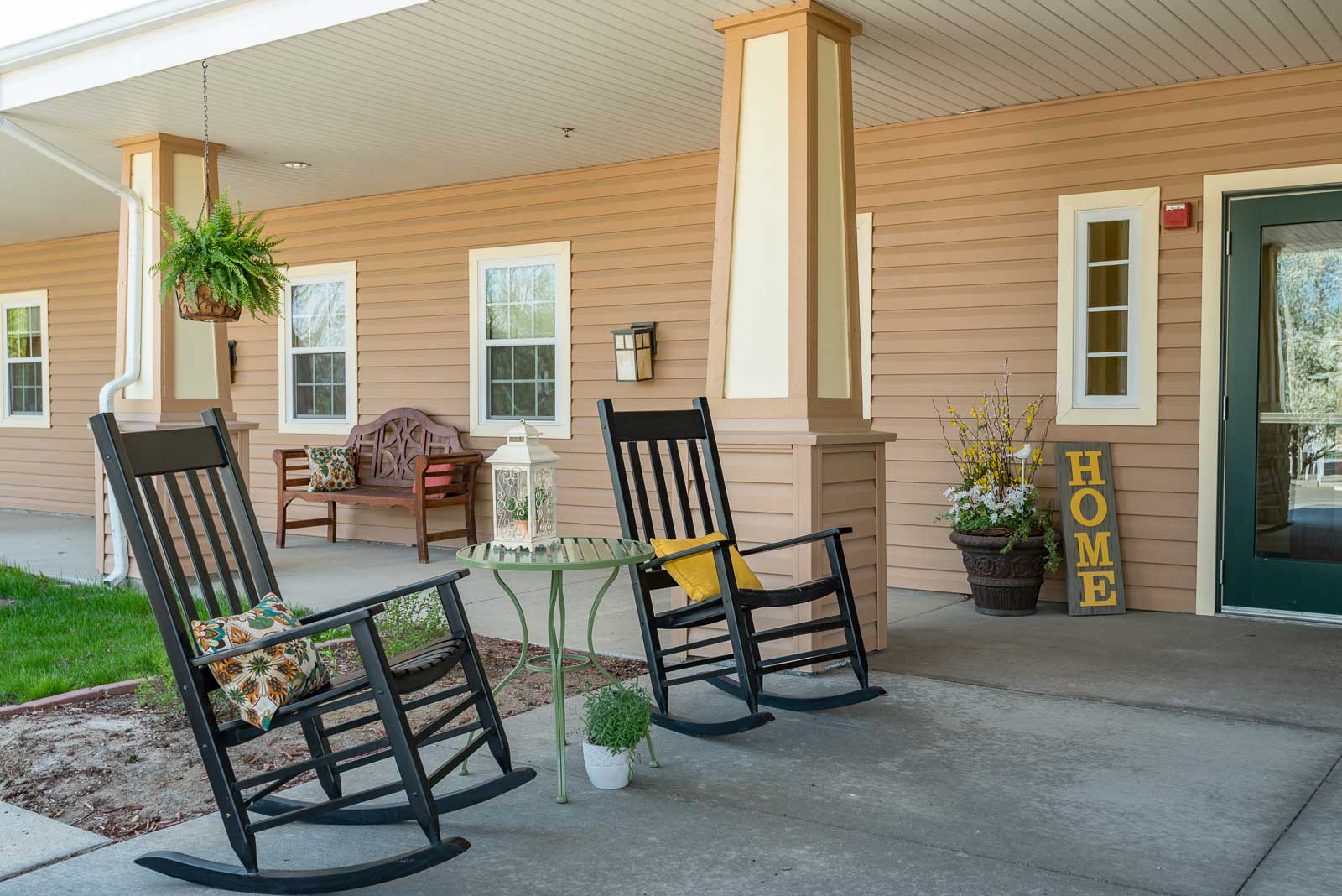 Two rocking chairs are on a porch at Windsor Manor Grinnell, Grinnell, IA