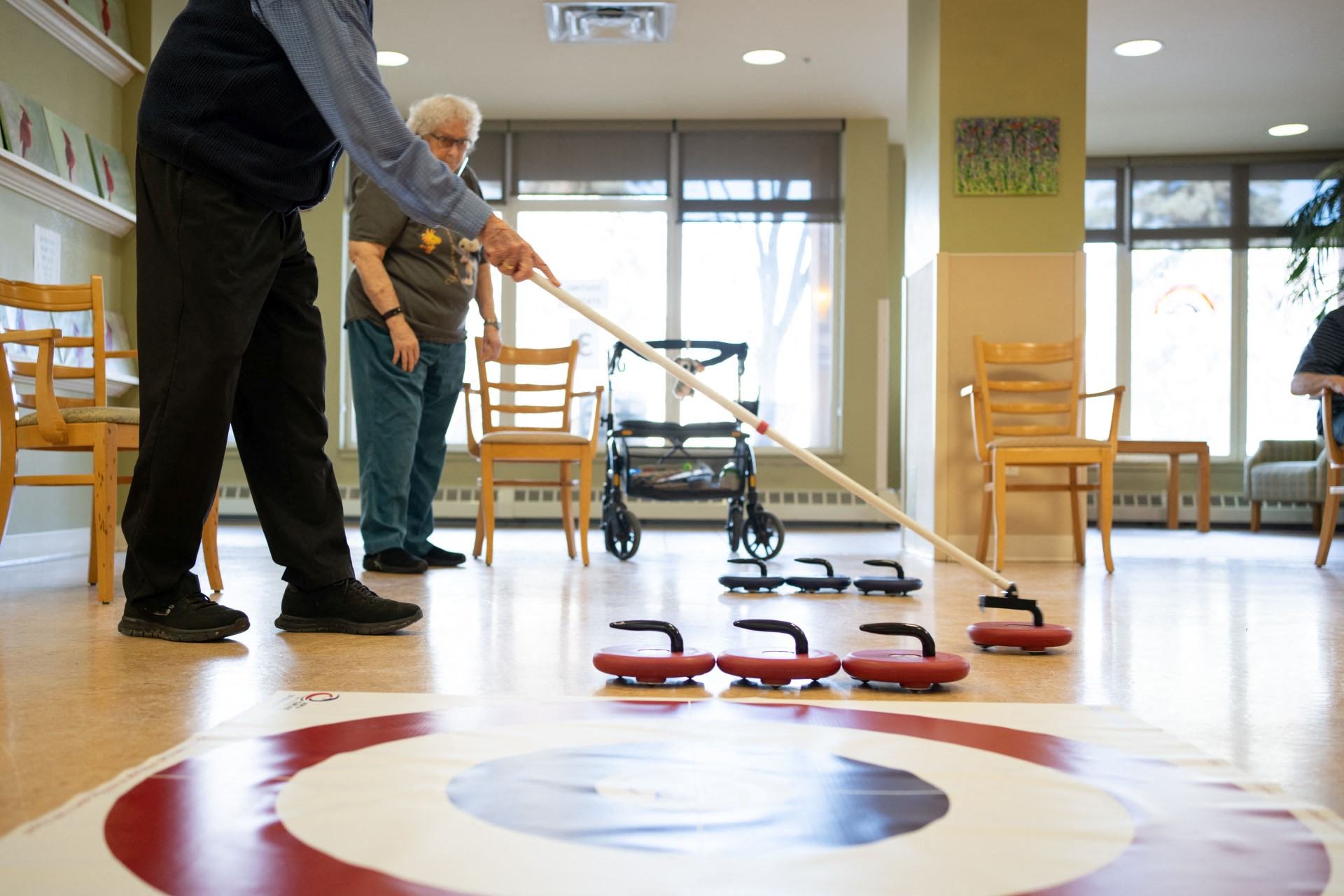 Residents playing a game of curling and living an active life