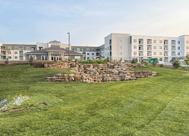 Rendering of clubhouse with complex behind