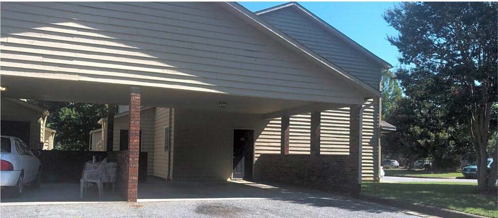 a house with a car parked in front of it