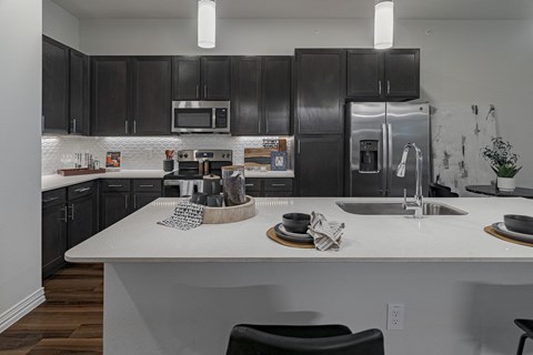 Open Concept Kitchen Featuring Hardwood Style Flooring