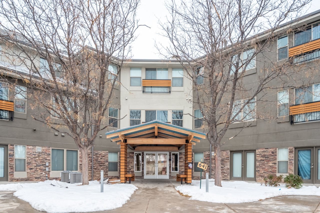 Large awning over entrance Exterior view of 6th with awning covered entrance