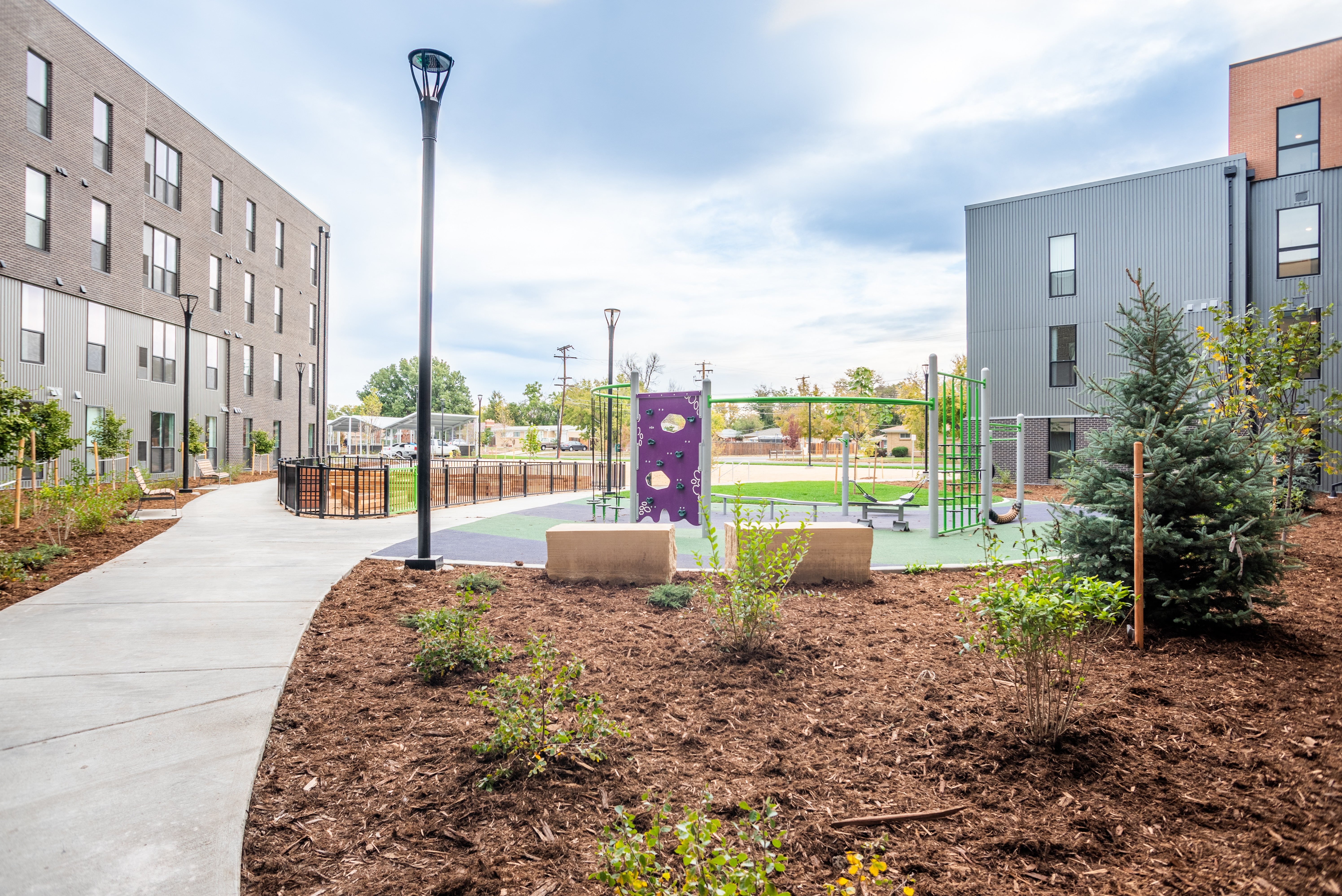 Playground with purple wall climbing wall and balance apparatus