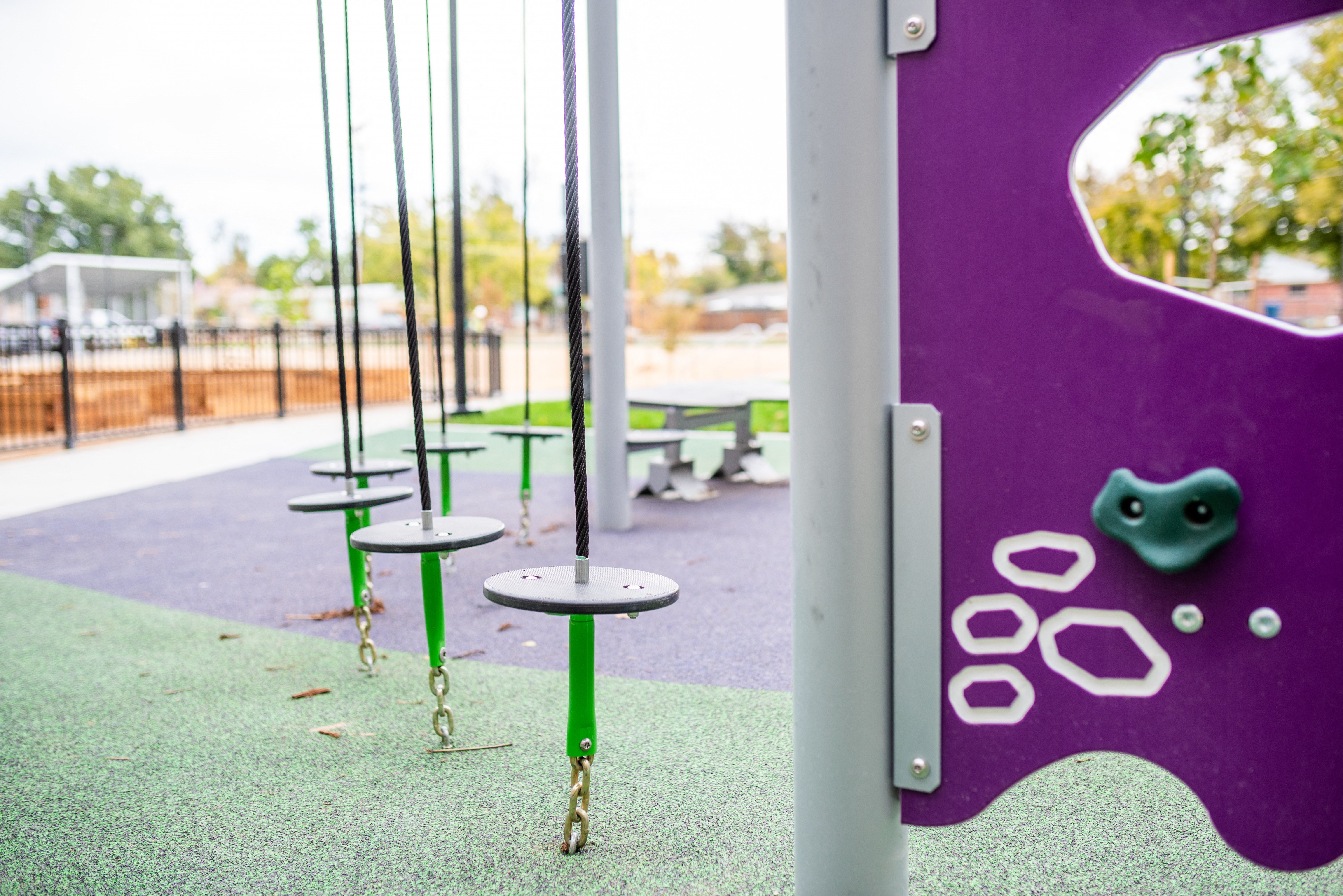 Close up of playground equipment, stepping stools on elongated secured chains