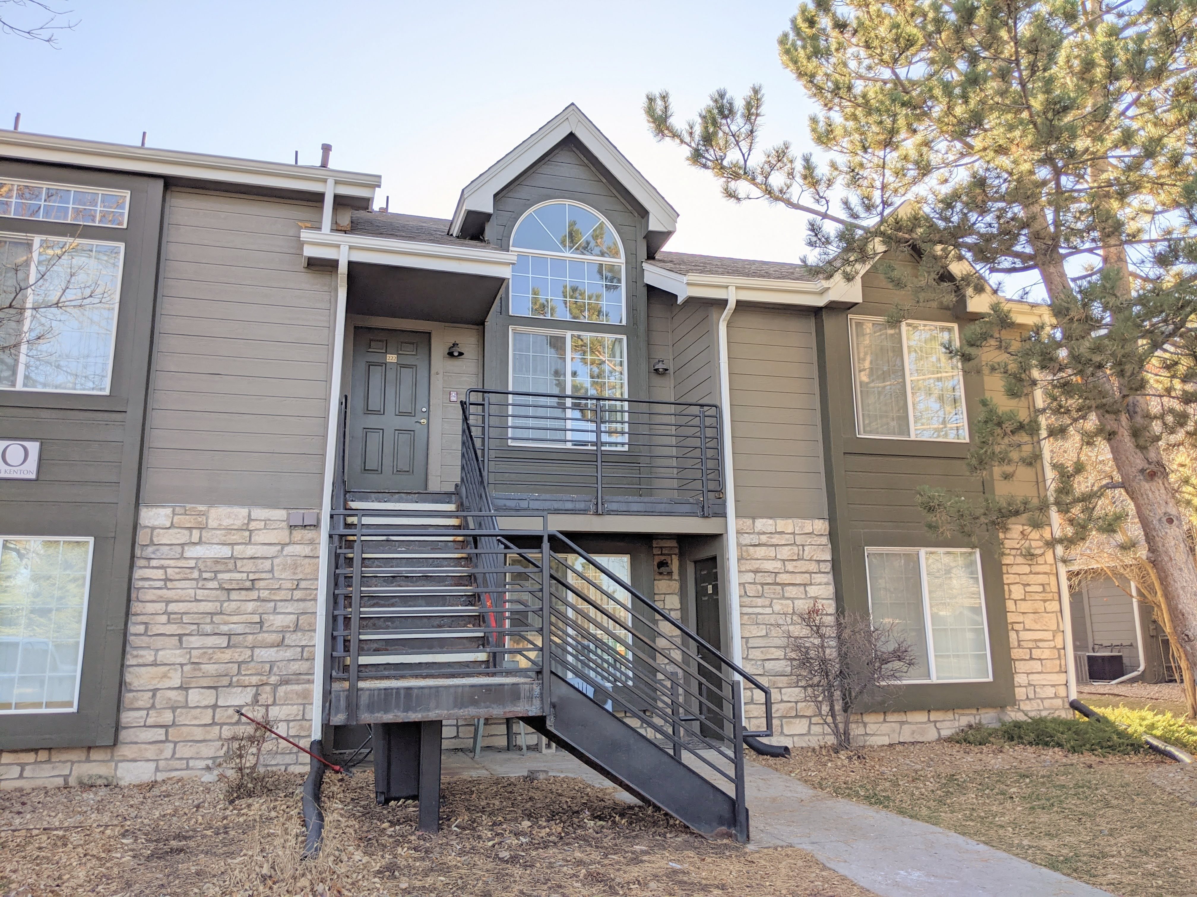 Exterior First Avenue Exterior shot of First Ave unit, green siding half brick