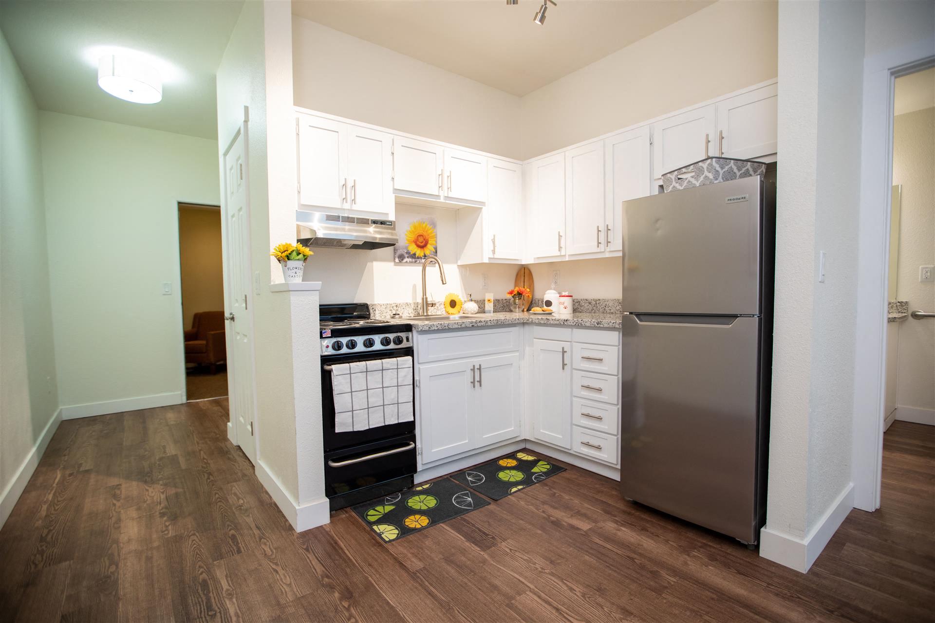 Kitchen cabinets and fridge at Cogir of Stock Ranch, Citrus Heights, CA, 95621