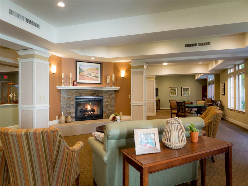 Posh Lounge Area With Fireplace In Clubhouse at Cogir of Stock Ranch, Citrus Heights, California
