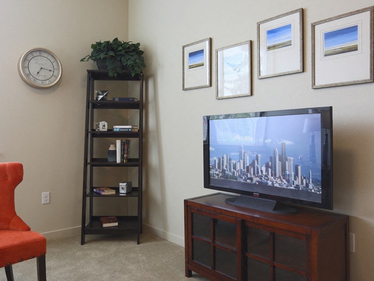 model living room with tv at The Lofts by Cogir Senior Living, Vancouver, Washington
