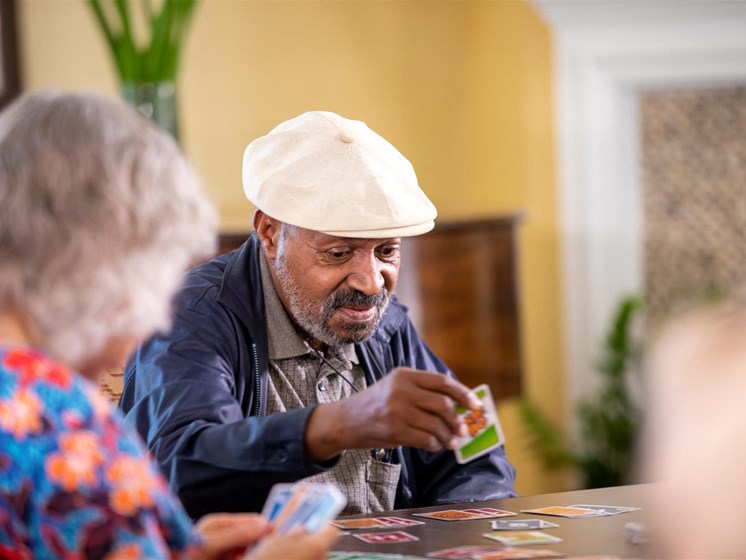 Senior Resident Playing Cards at Cogir of North Bay, Vallejo, CA