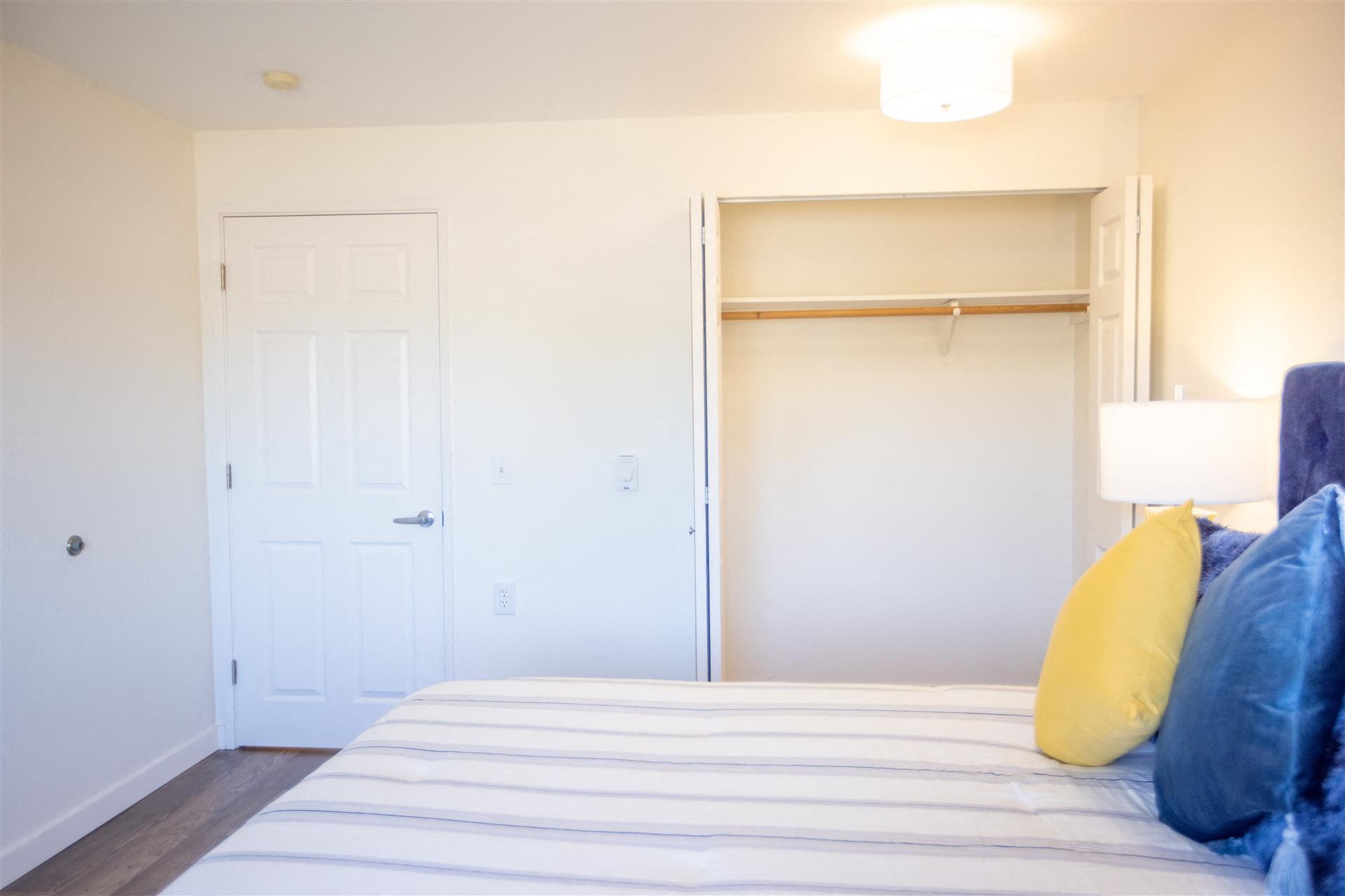 Bedroom with closet at Cogir of Northgate, Seattle, Washington