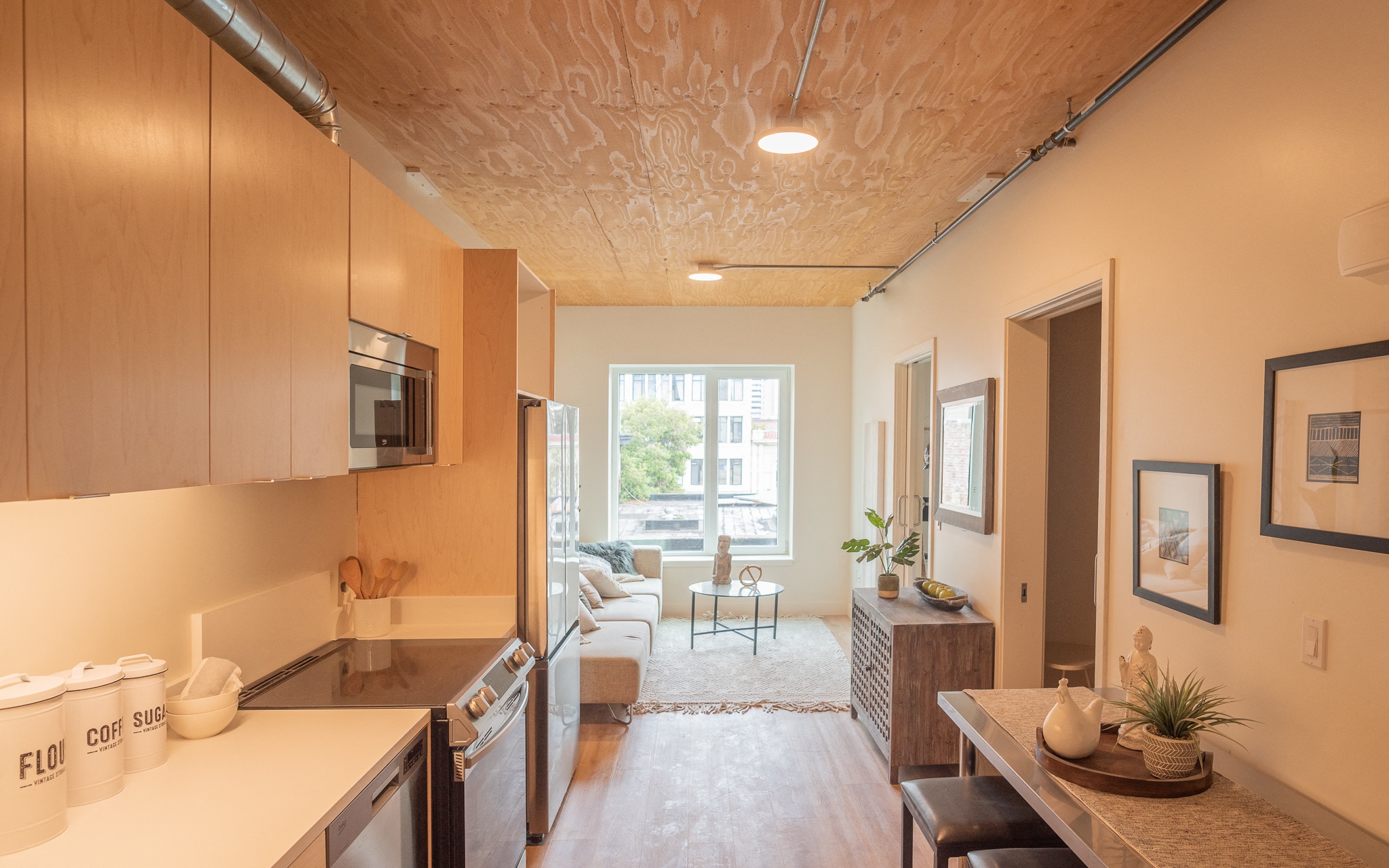 a kitchen and living room in a small apartment