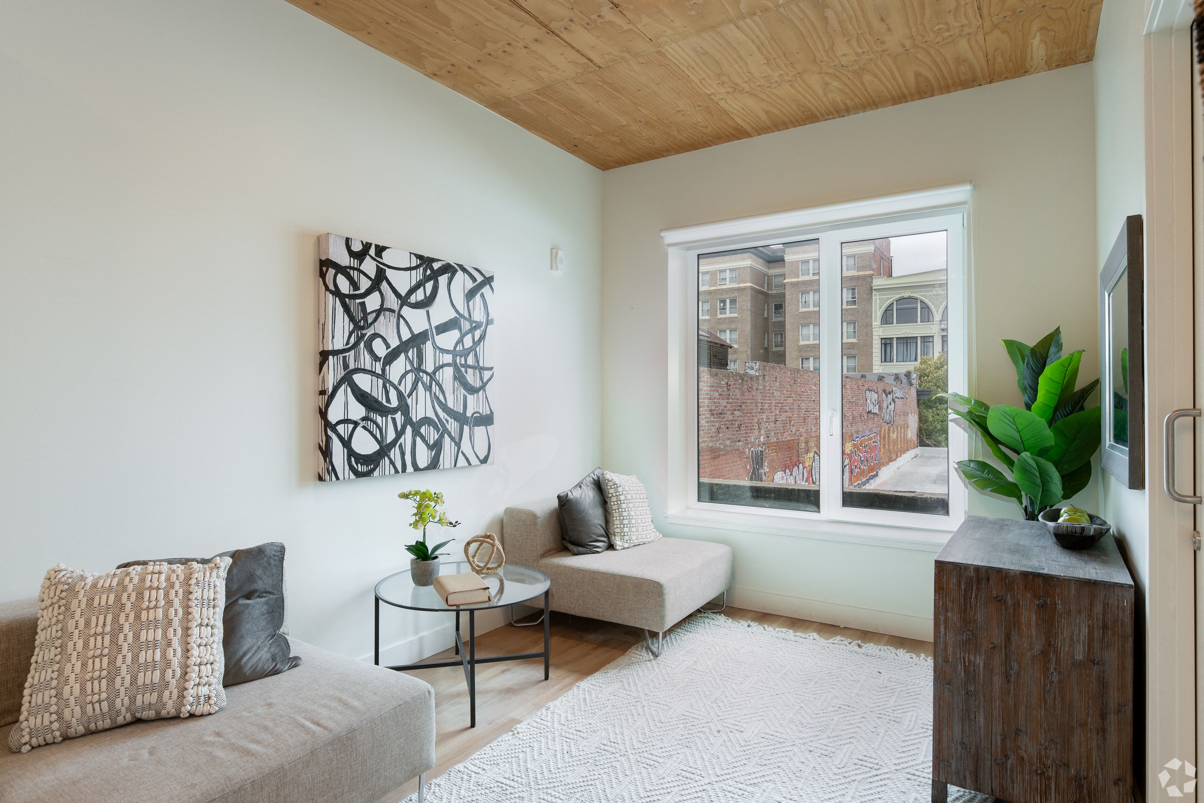 a living room with a couch and a window