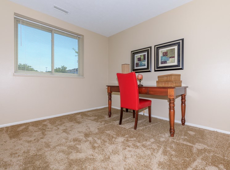 Second bedroom in a standard unit with plush carpeting