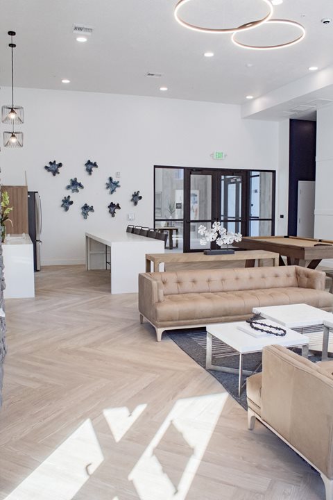 A living room filled with furniture and a large window