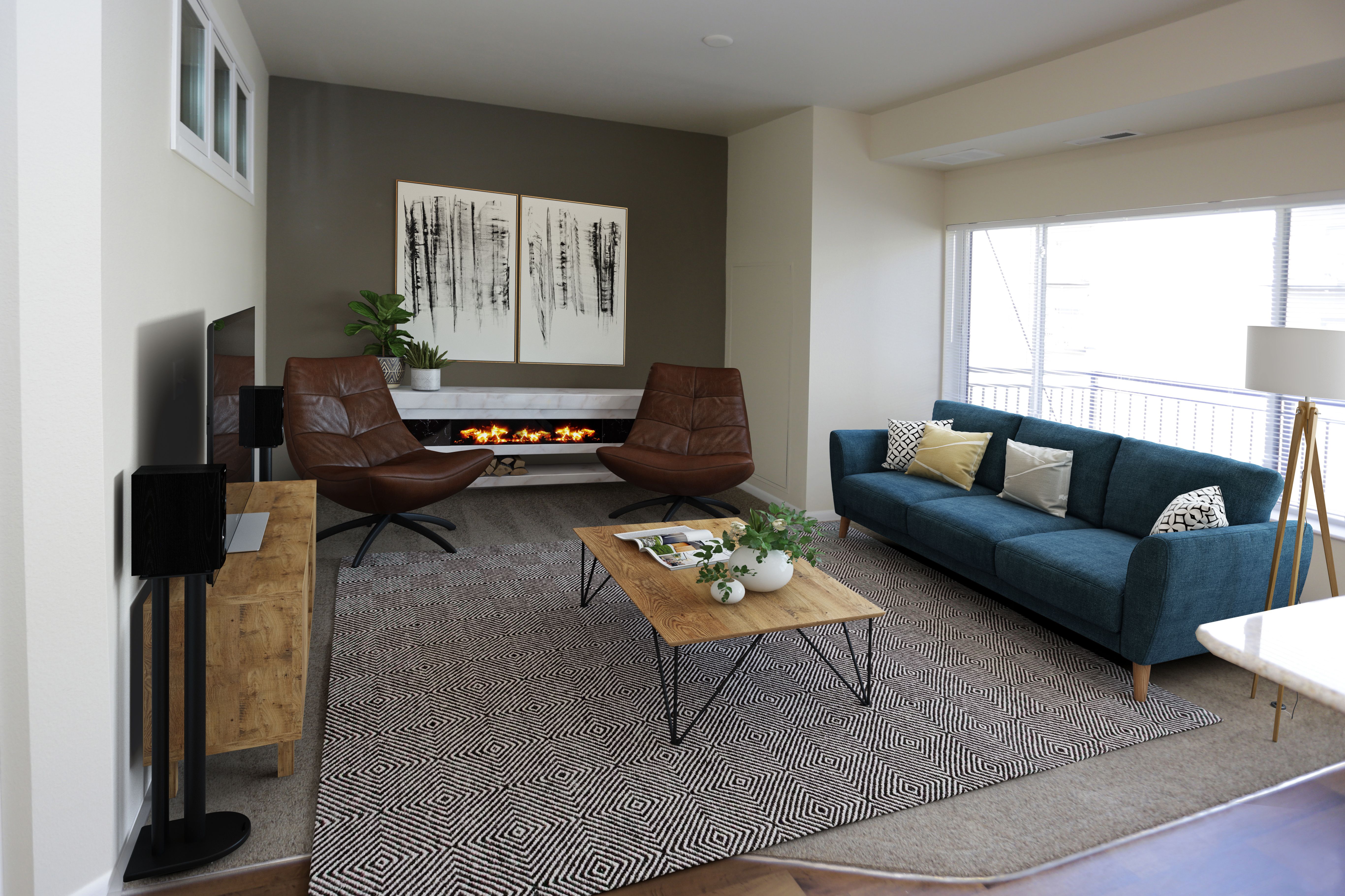 A living room with a fireplace and a painting on the wall.