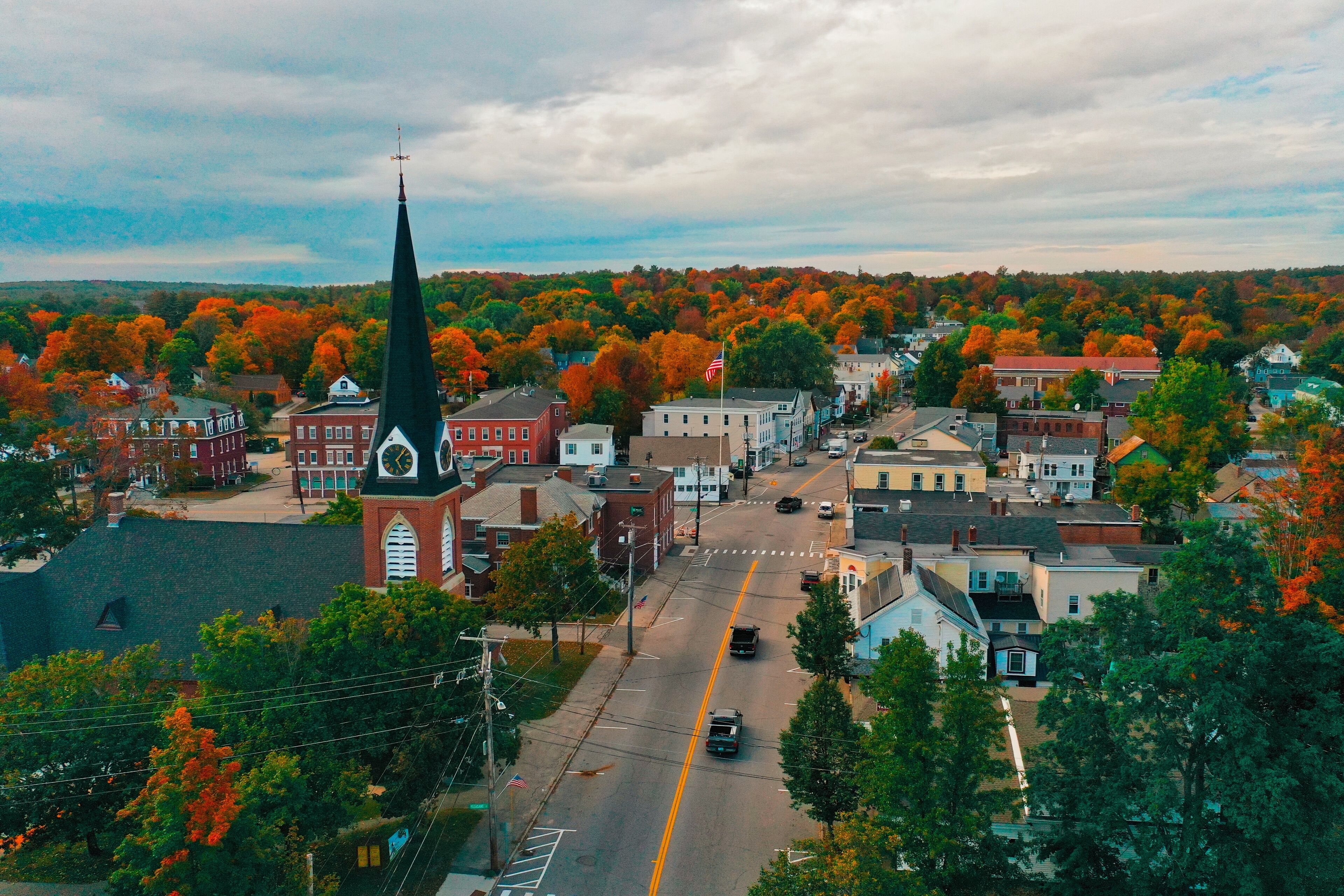 A small town with a church steeple in the center.