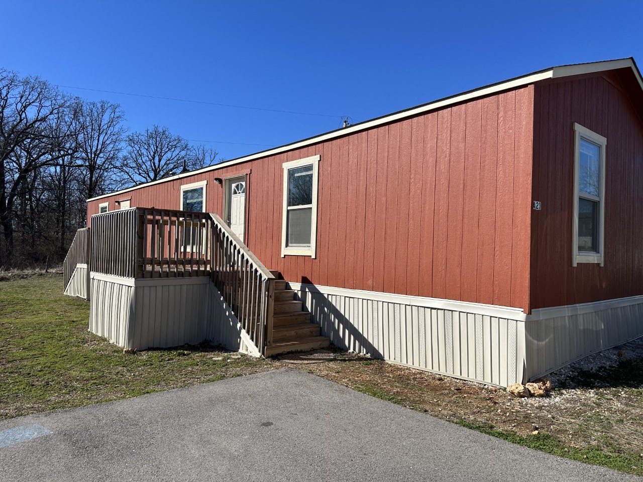 a red building with a white fence in front of it