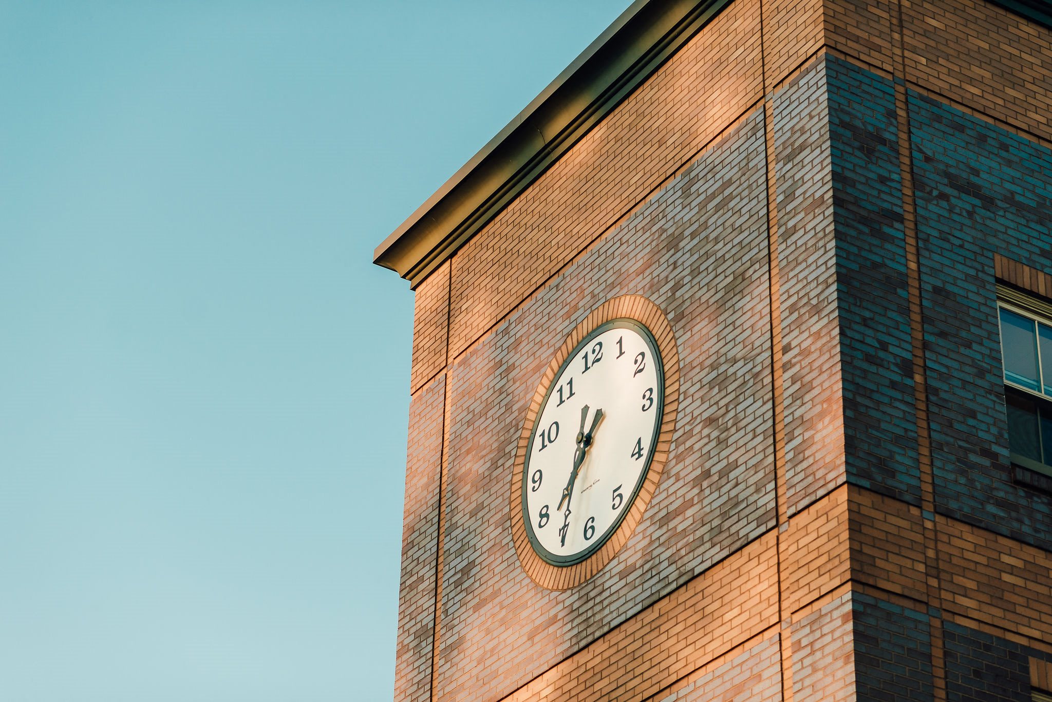 clock tower on historic apartment building