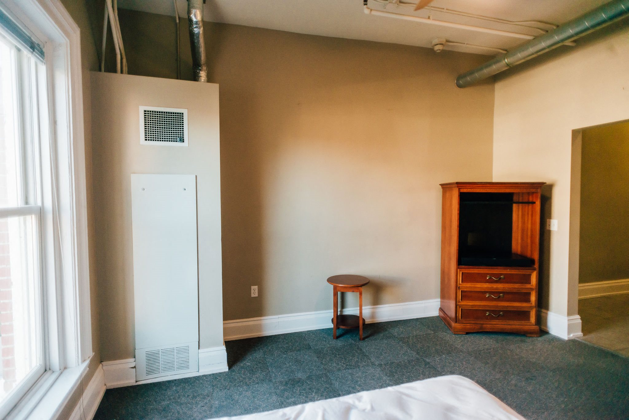 Bedroom with beige walls downtown building