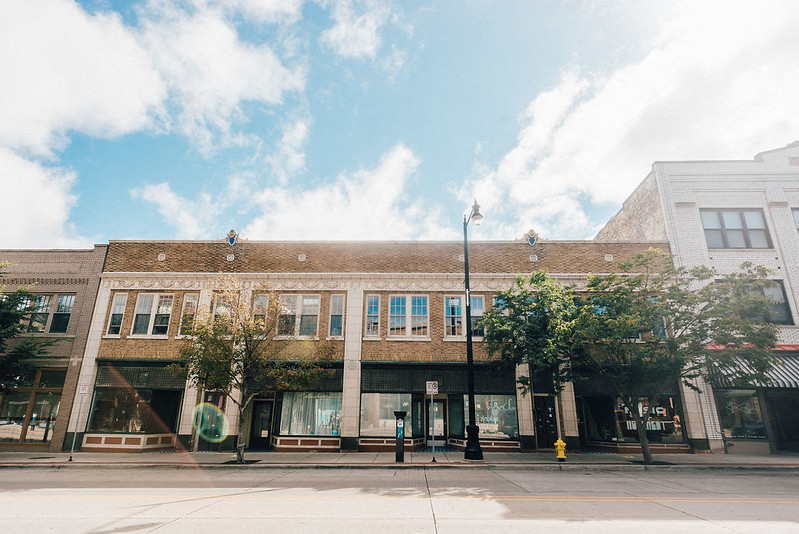 front of historic brick apartment building