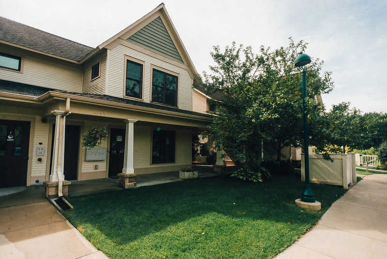 townhome with grass and landscaping