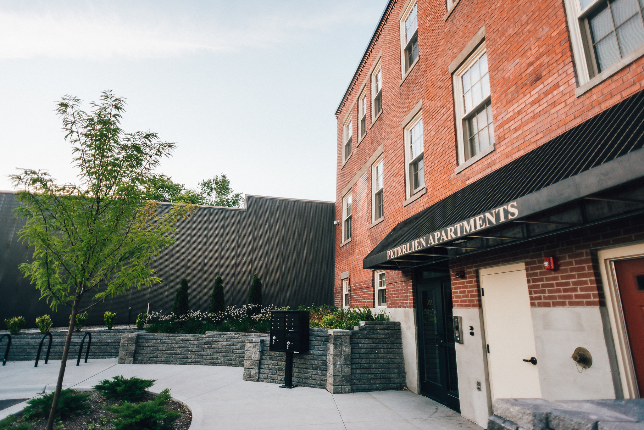 apartment entrance with to historic brick building
