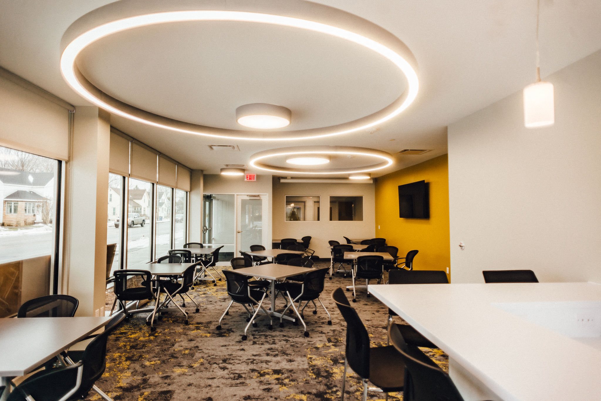community room with seating modern light fixtures