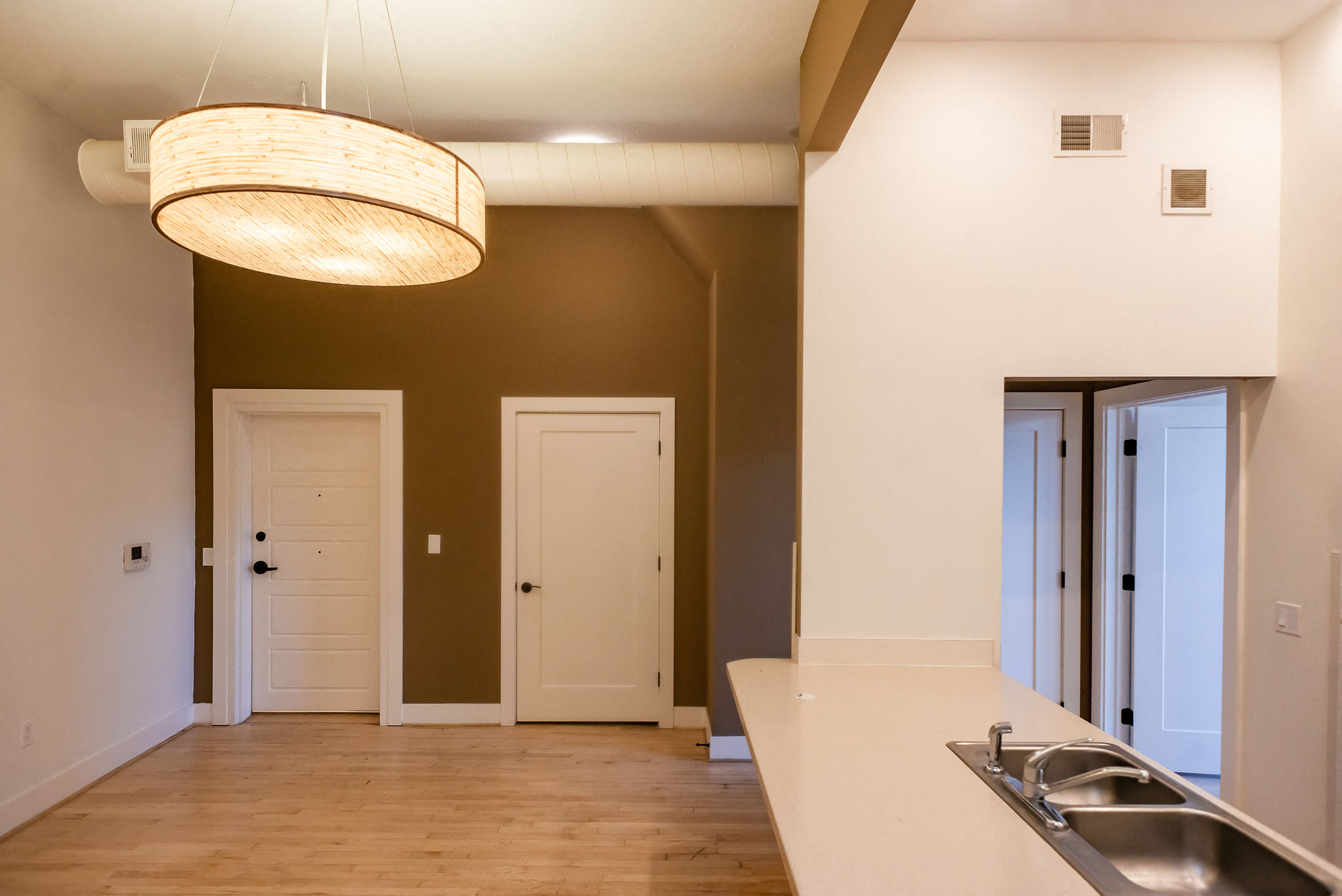 open living concept white countertop lvp flooring