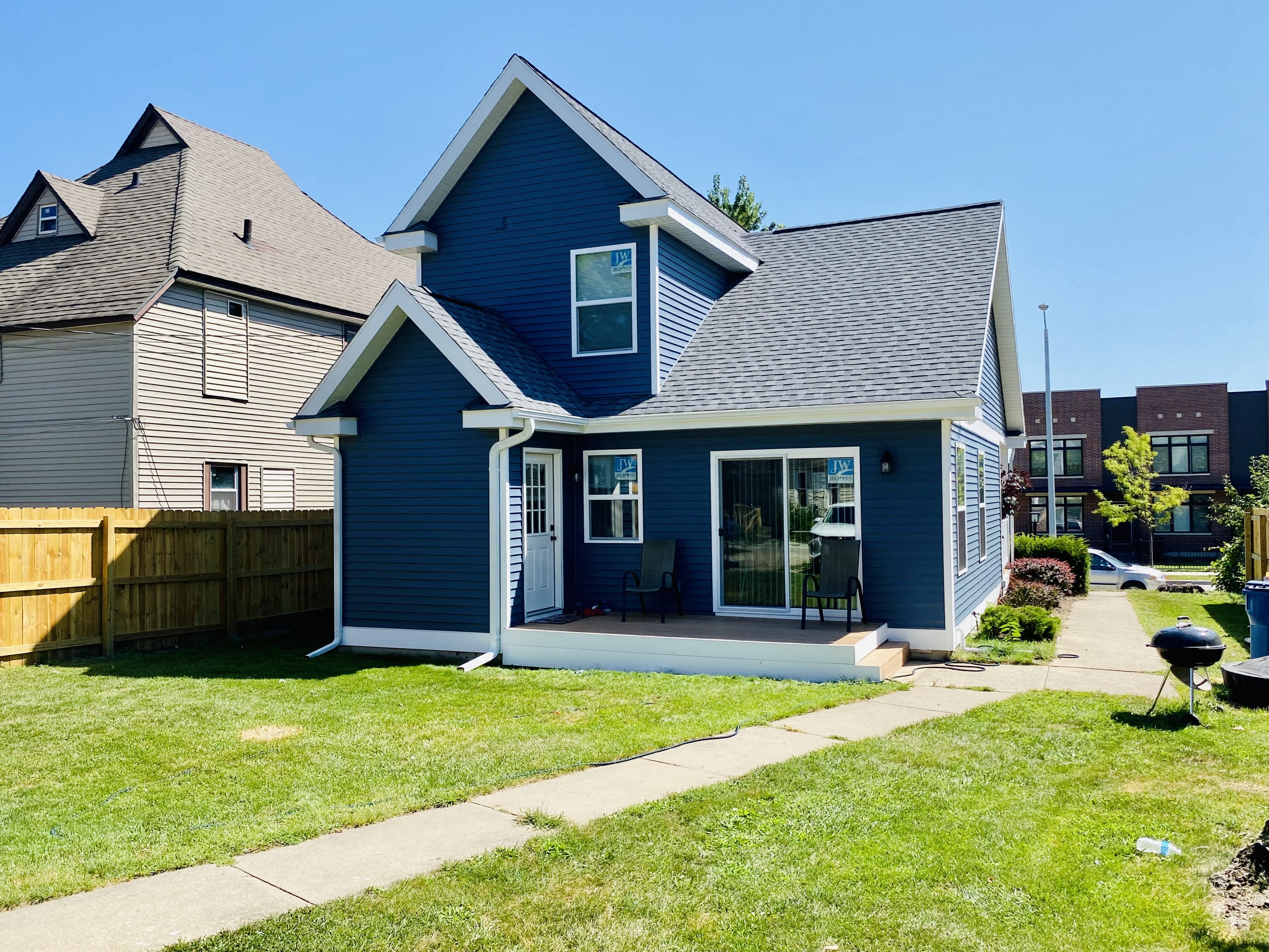 blue sided home backyard