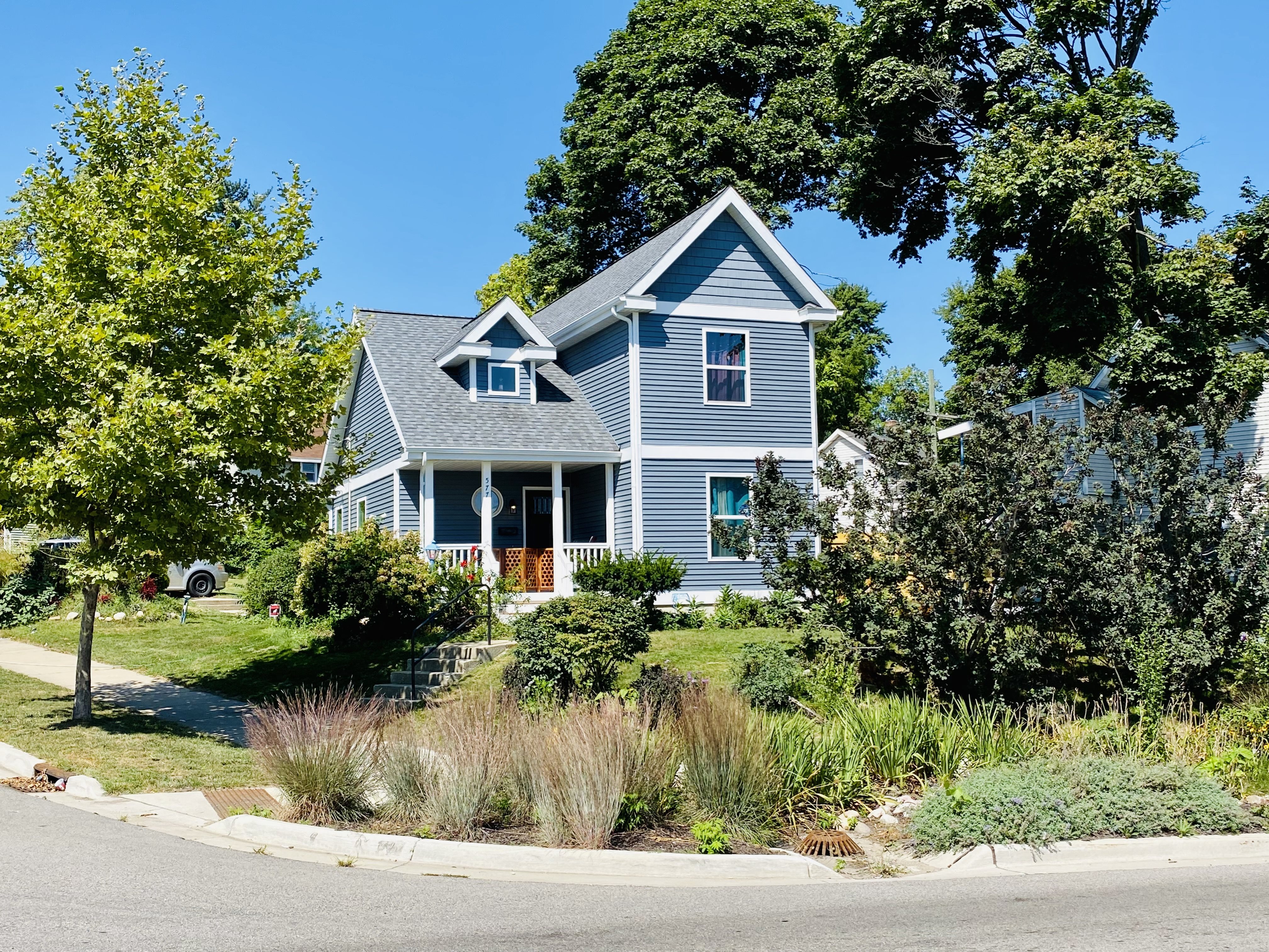 blue sided house with landscaping