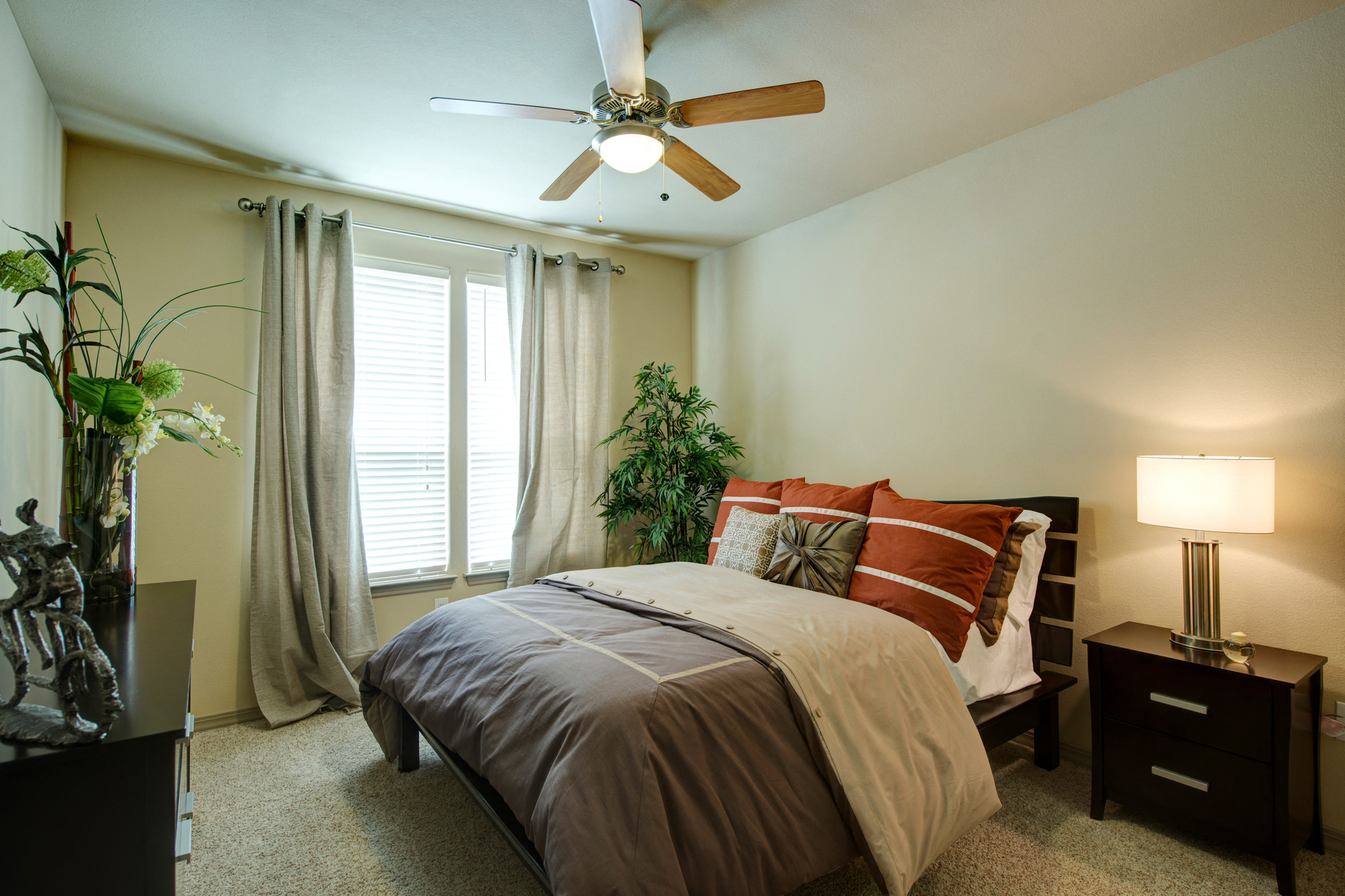 a bedroom with a ceiling fan and a large window at Retreat at Shadow Creek Ranch Apartments, Houston, 77584
