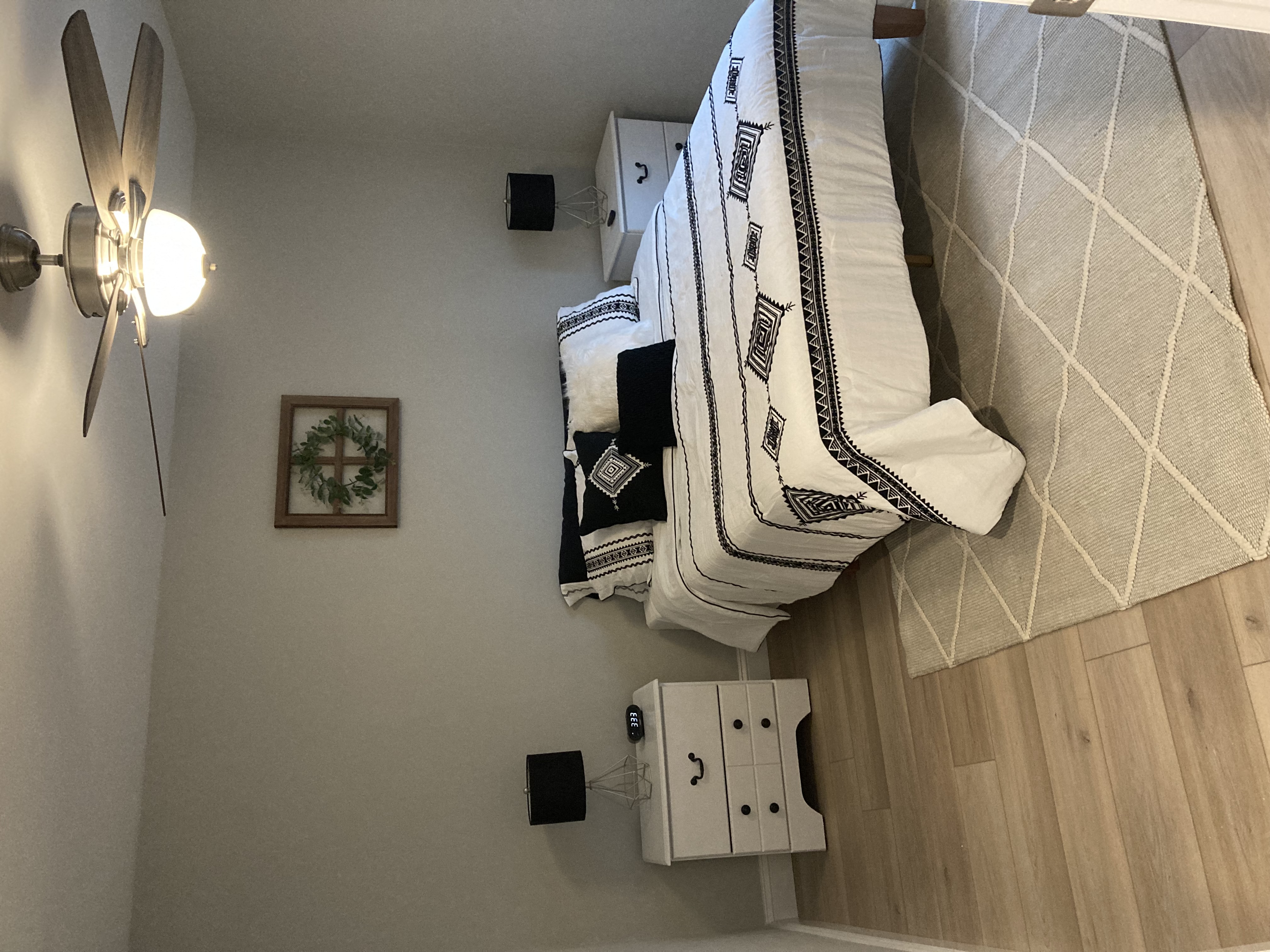 a staircase in a living room with a bunch of pillows on the wall
