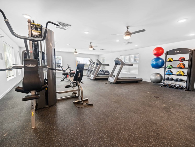 a workout room with treadmills and other exercise equipment  at Union at Wiley, Cedar Rapids, 52404